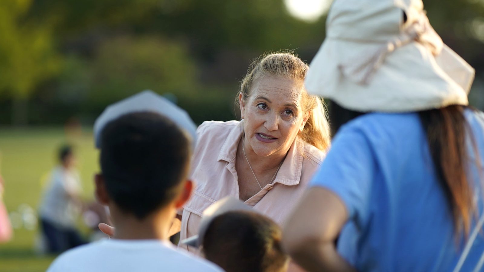 Jared in a warm one-on-one moment with people at a community event
